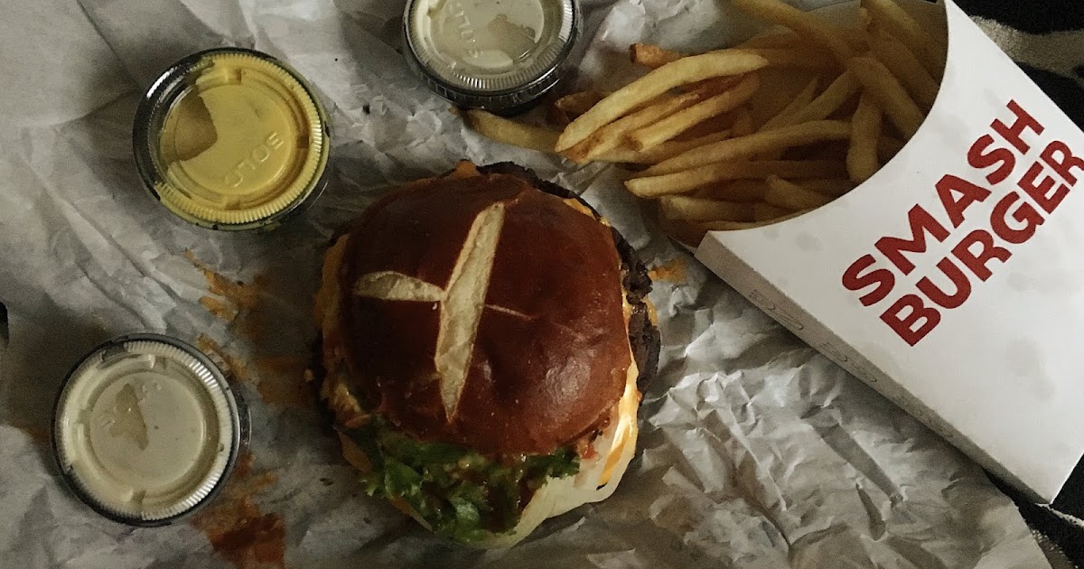 Enjoying a veggie burger from Smashburger