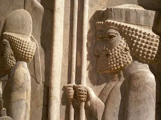 Ancient Persian city of Persepolis, founded by Darius the Great around 518 B.C. shows elaborate wall carvings of men wearing hoop earrings