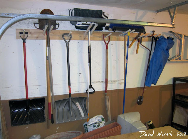 garage shelf, tool rack, garden tools, hang on wall, shovel, snow shovel, rake, broom