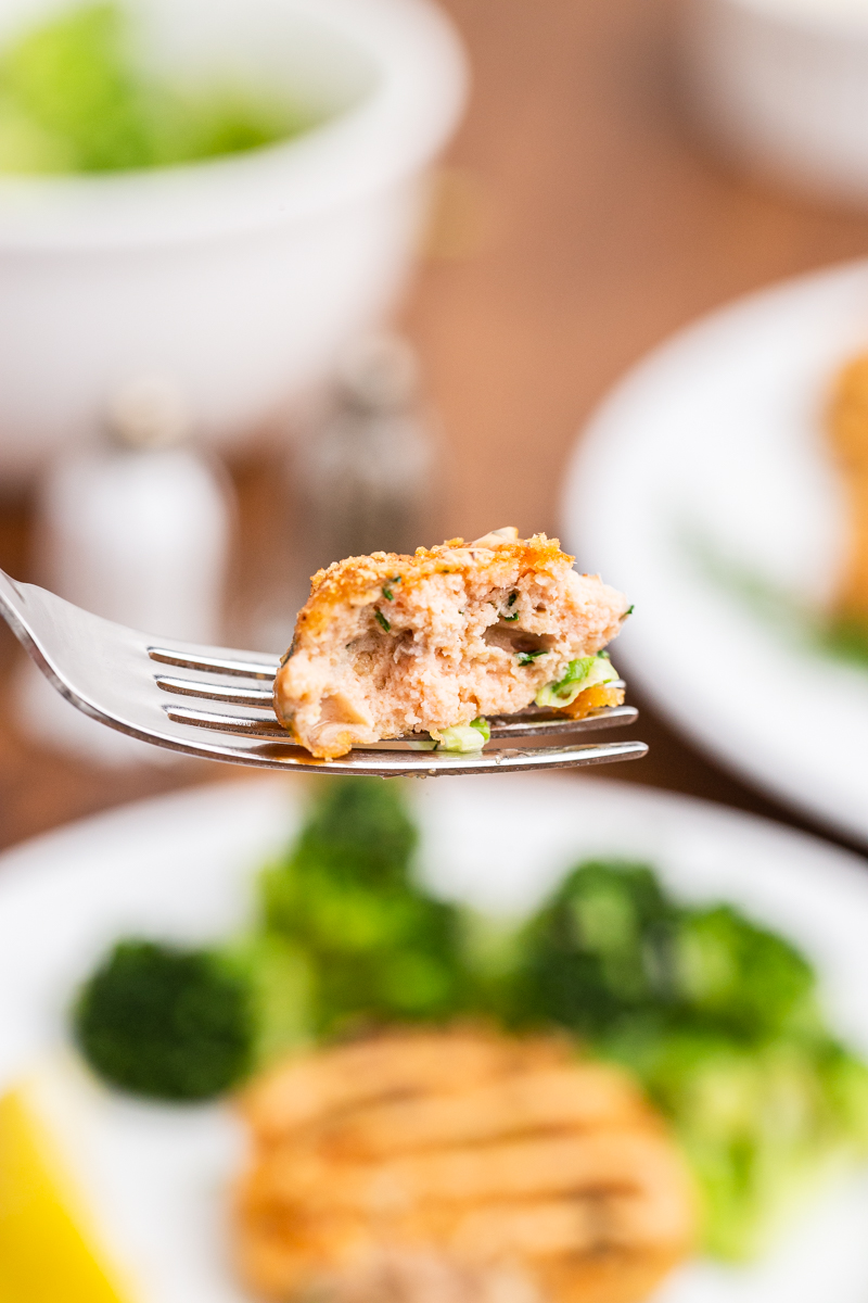 Very close up photo of a bite of Keto Salmon Cakes (Salmon Patties) on a fork.