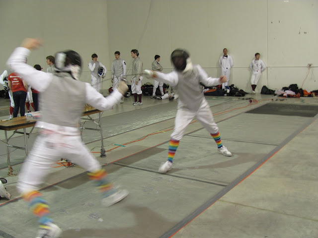 A fencing match in action