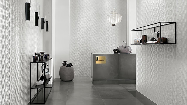 Tile design on wall with multi-faceted reliefs surfaces