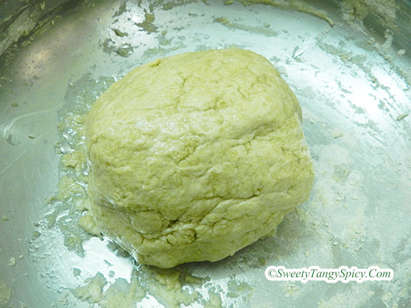 A bowl of chapati dough covered with oil, ready to rest and rise.