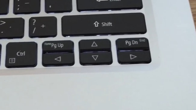 Small and very closely placed 4 arrow keys with Page Up and Down keys.