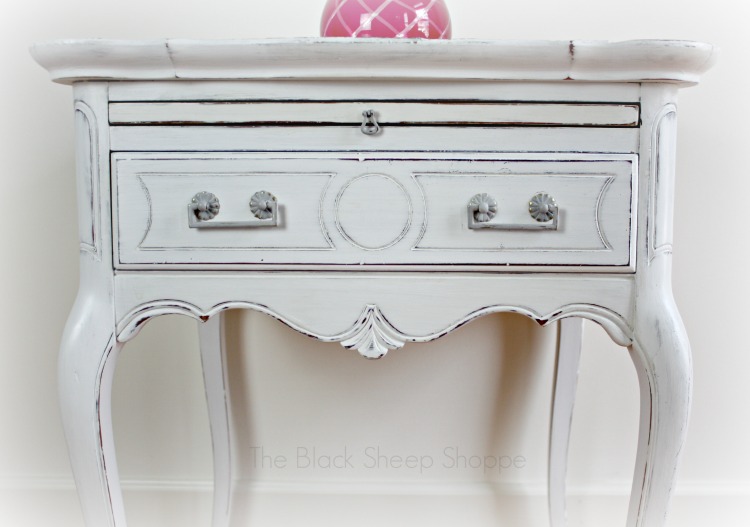 Scalloped trim on side table. Scalloped trim on side table.