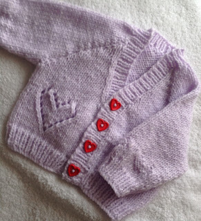 https://www.craftsy.com/knitting/patterns/hearts-and-sparkle-baby-cardigan/479374