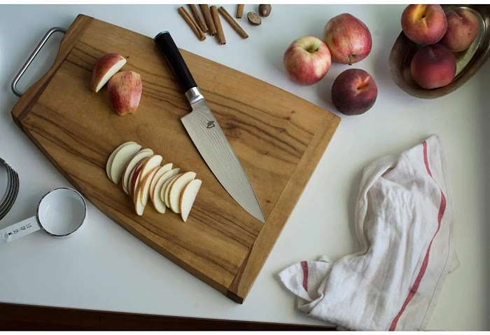 How do you keep the chef's knife blade straight and sharp?