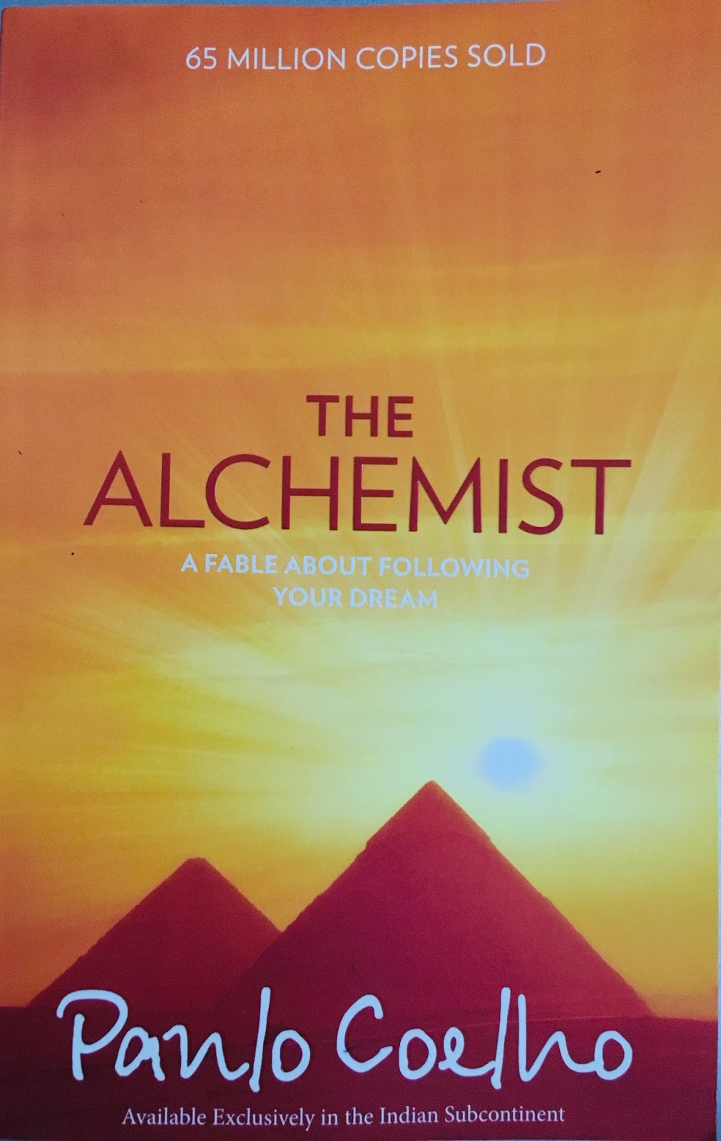 book review of alchemist in 100 words