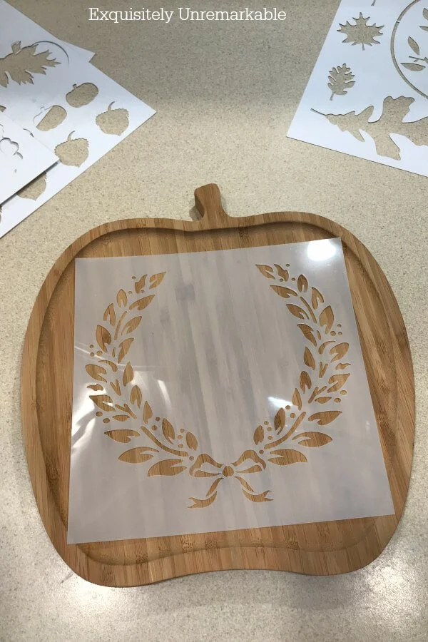 Garland Wreath Stencil on an apple shaped cutting board