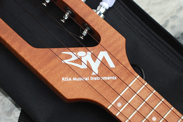 Risa Uke Solid ukulele logo