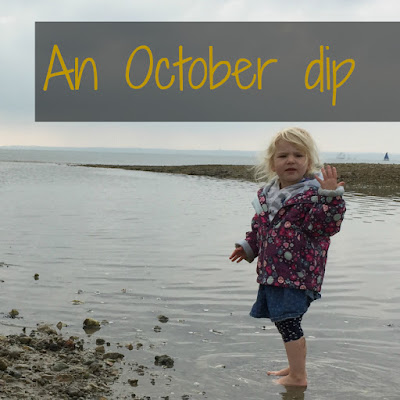 Tin Box Tot paddling in the sea