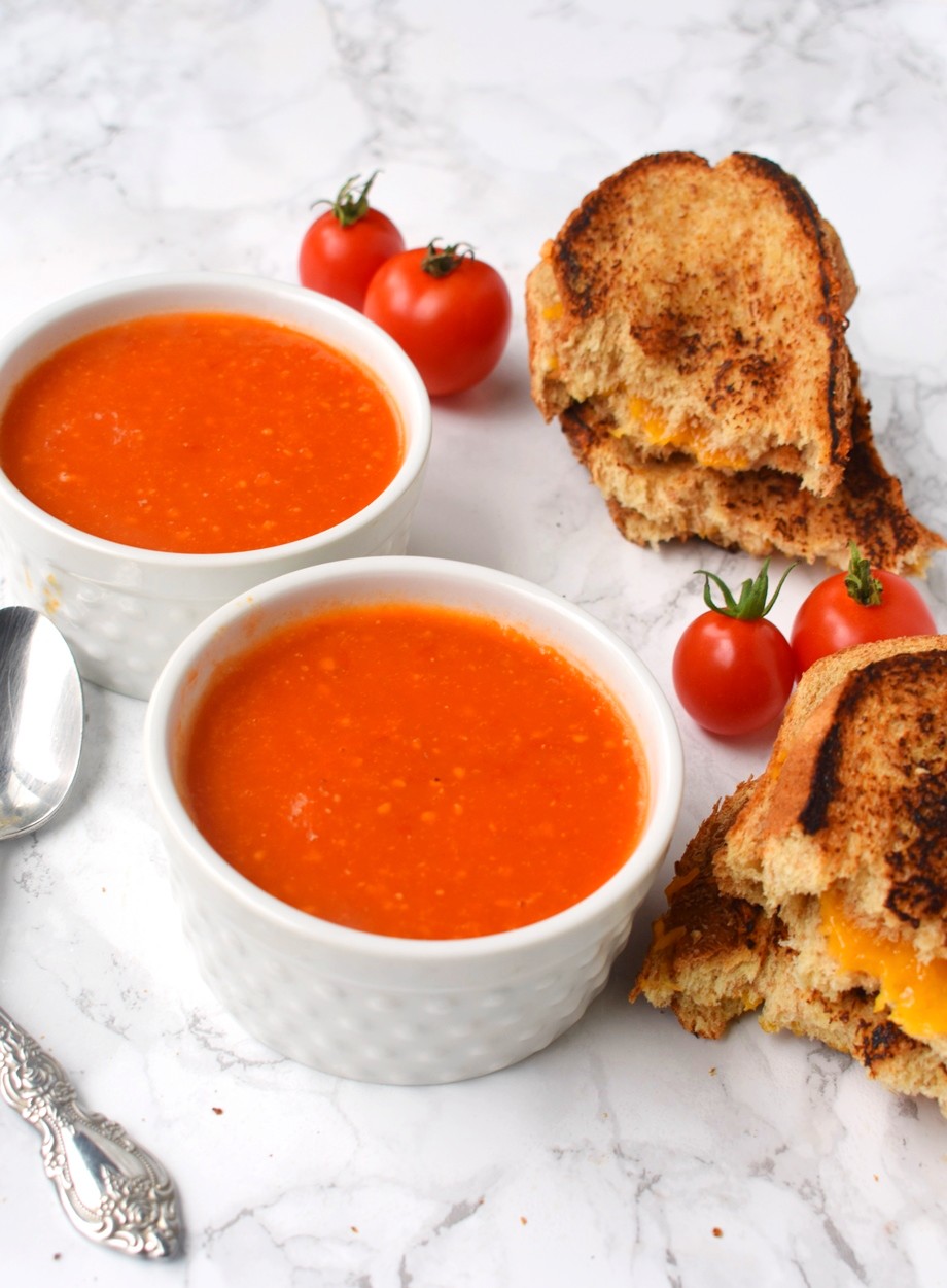 The Easiest Tomato Soup is ready in about 15 minutes and has just 4 ingredients- tomatoes, onions, garlic and butter! Pair it with a grilled cheese sandwich for a cozy, comforting meal. #soup #tomatosoup #comfortfood #tomato #tomatoes #healthy #cleaneating