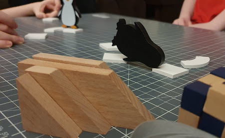 Penguin Party wooden family game being played on table