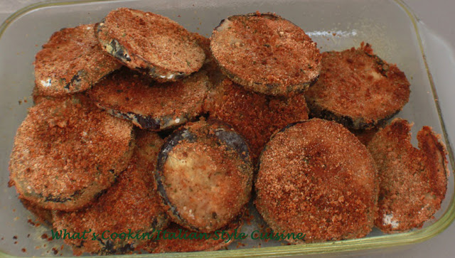 these are a baked eggplant chips and in a glass dish baked