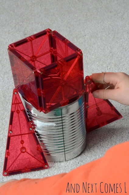 Building a rocket by putting magnetic tiles on a tin can