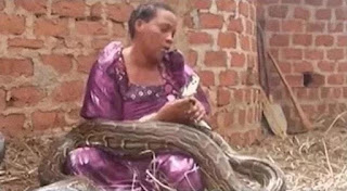 Lady Who Gave Birth To A Set Of Twins, A Girl And Python Refuses To Let Go Of The It
