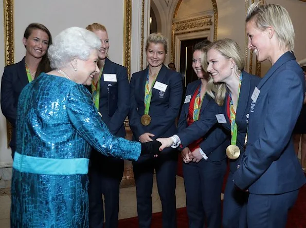 Queen Elizabeth, Prince William, Catherine, Duchess of Cambridge, Prince Harry, Princess Anne and Prince Edward. Kate Middleton wore Alexander McQueen Silk Floral Midi Dress 