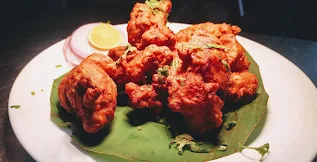 Garnished chicken fry in serving plate for chicken fry recipe