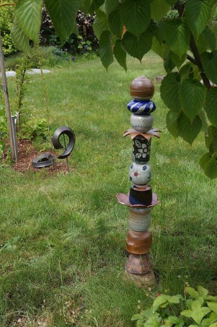 Handmade ceramic pottery garden totem in my garden.