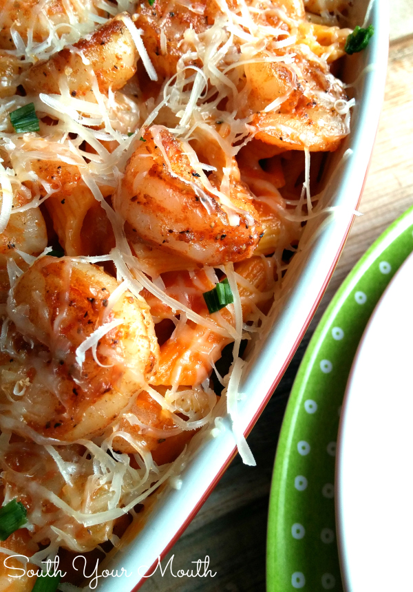 Easy Shrimp & Pasta! A quick and easy pasta recipe with seasoned sauteed shrimp, your favorite pasta sauce and freshly grated parmesan! This whole dish cooks in the time it takes to cook the pasta! Can substitute chicken for shrimp too!