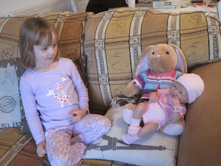 Mabel with stuffed bunny and baby doll