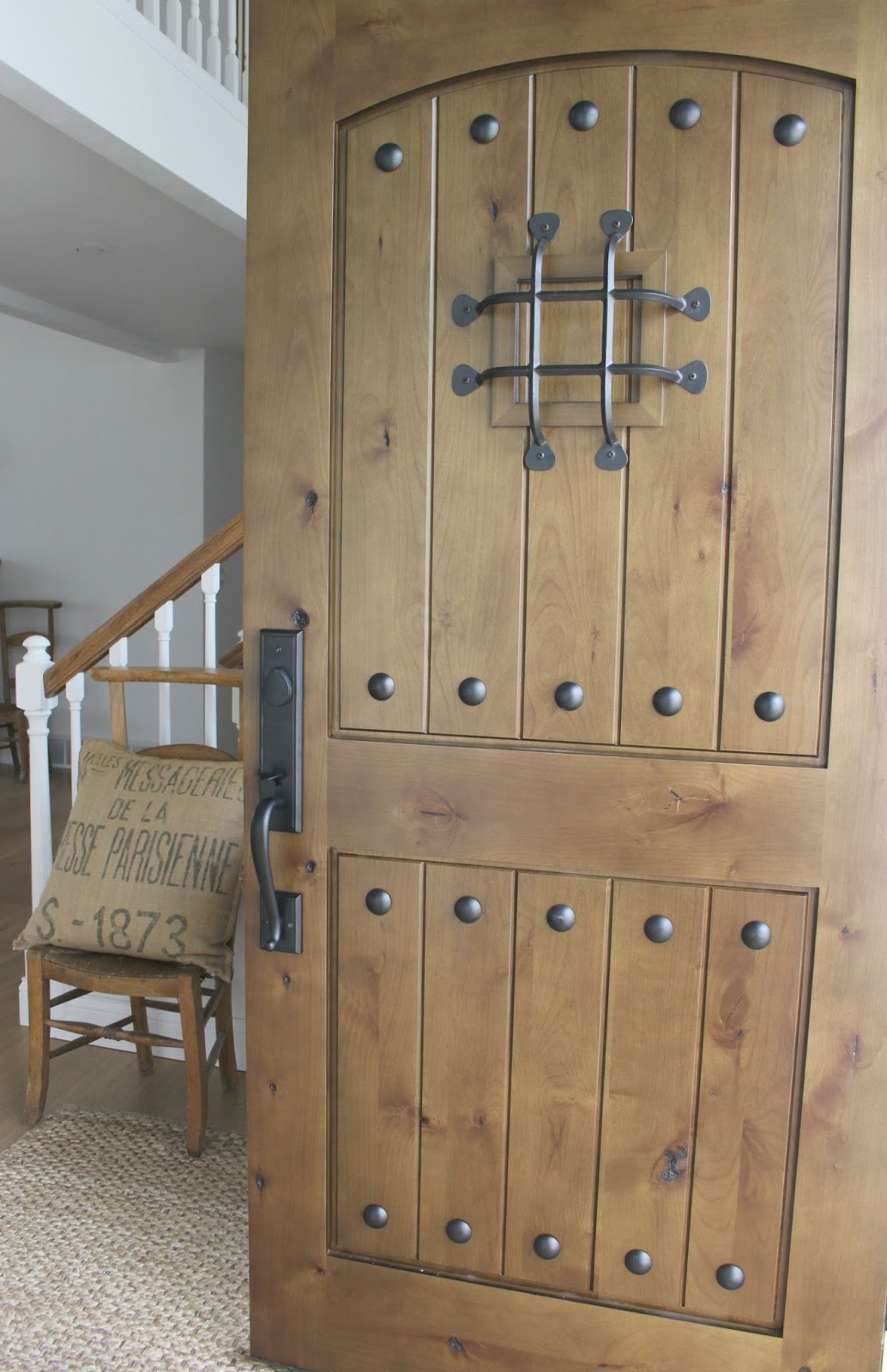 My rustic alder front door - Hello Lovely Studio. Rustic Old World Style Wood Doors [Design Inspiration] with photos of doors old and new to inspire your design ideas.