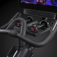 Adjustable multi-grip handlebars & 2x 3 lbs dumbbells, image, on NordicTrack Commercial Studio Cycle S15i & S22i spin bike