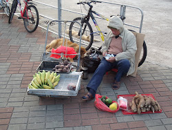 Vendor selling his meagre items.
