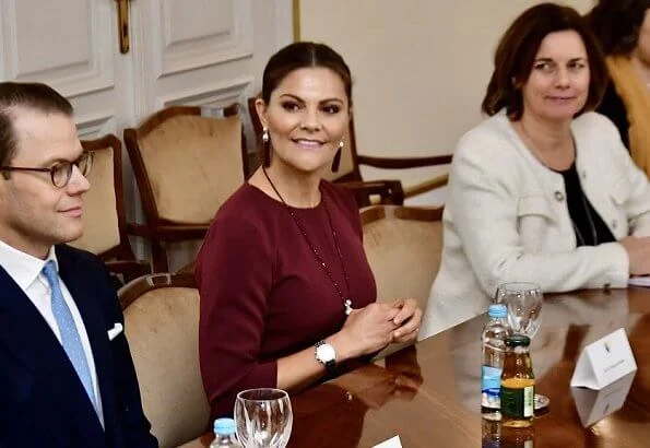 Crown Princess Victoria wore Andiata Kamille trousers and Kiana blouse. Vogt bag and Stinaa J boots. Oscar de la Renta earrings