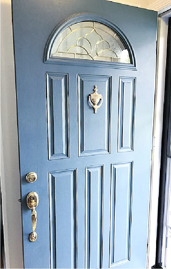 blue door with arched window