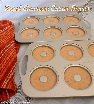 Baked Cinnamon Carrot Donuts are studded with carrots, full of cinnamon flavor, and topped with a sprinkling of cinnamon sugar. | Recipe developed by www.BakingInATornado.com | #recipe #donuts