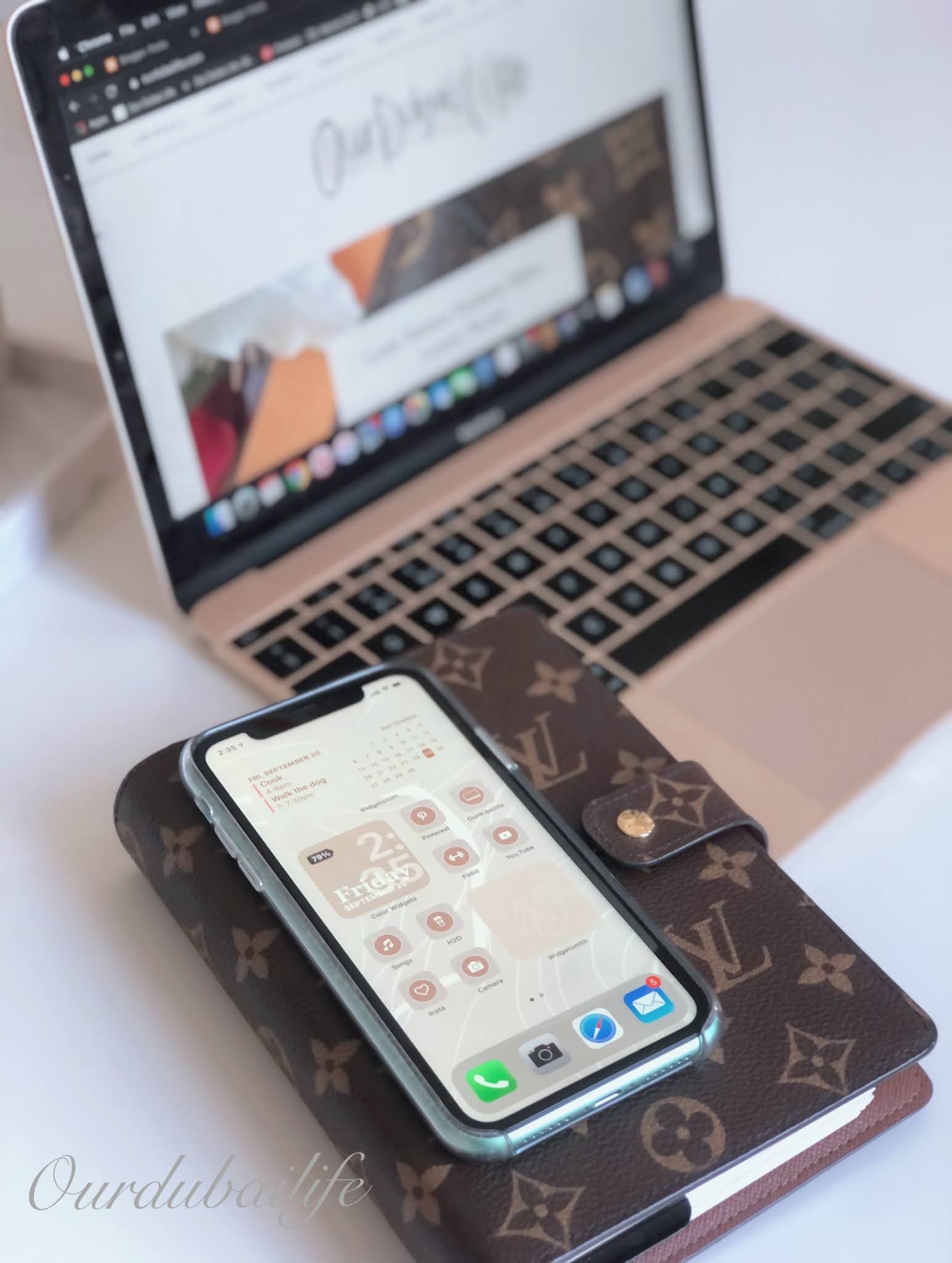 iPhone 11 flatlay and gold macbook