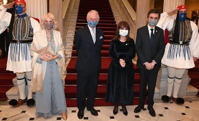 Prime Minister Kyriakos Mitsotakis and Katerina Sakellaropoulou. Camilla wore a tailored embellished maxi dress design by Anna Valentine