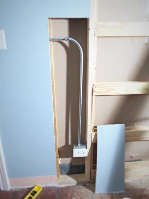 reinstalling the wall outlet next to pocket door