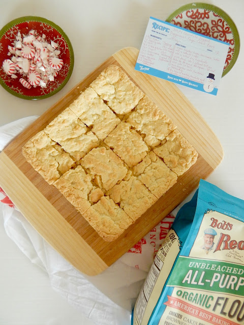 White Chocolate Dipped Peppermint Sugar Cookie Bars...a festive dessert for the holidays!  These peppermint sugar cookie bars taken up a notch dipped in white chocolate and sprinkled with crushed peppermints.  Perfect for your Christmas platter! (sweetandsavoryfood.com)