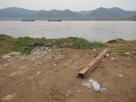 A spilled white drink next to the Xun River (浔江) in Wuzhou