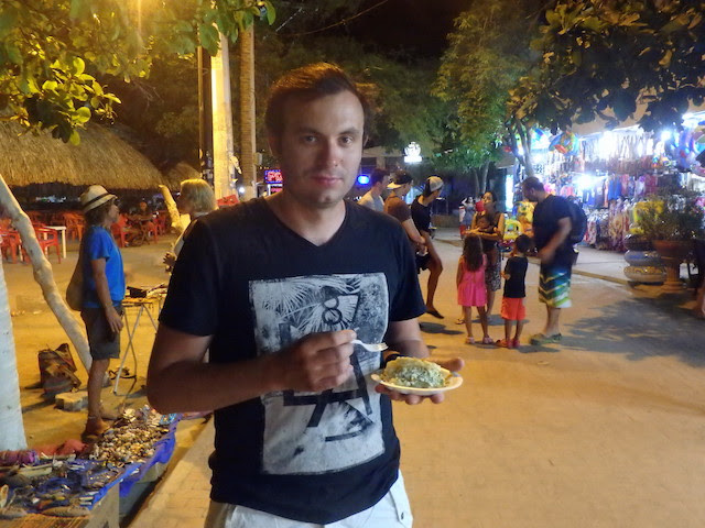 Eating arepa in Taganga, Colombia