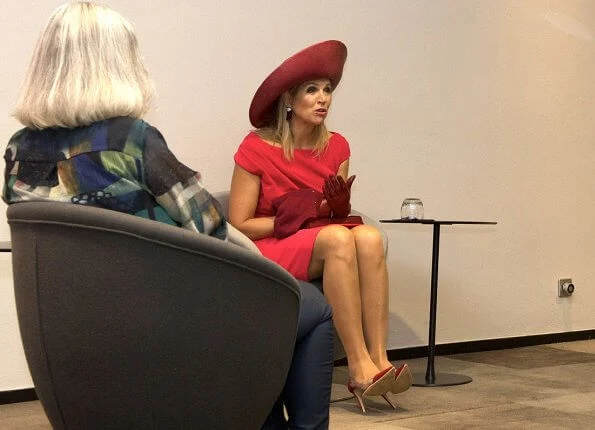 Dutch Breast Cancer Association. Queen Maxima wore a new short sleeve berry-red dress by Natan. Royal purple hat, earring Oscar de la Renta