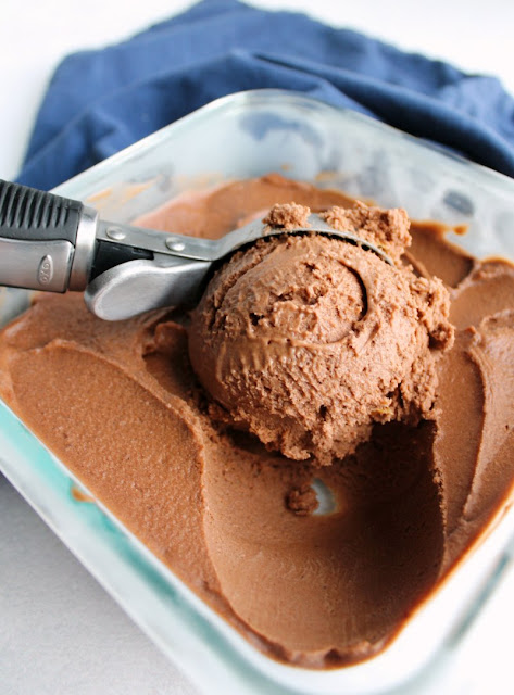 Peanut butter, chocolate and bananas come together to make this dairy free, gluten free, guilt free nice cream treat! It takes almost no effort to make and tastes like a dream! ice cream scoop making first big scoop of chocolate peanut butter nice cream