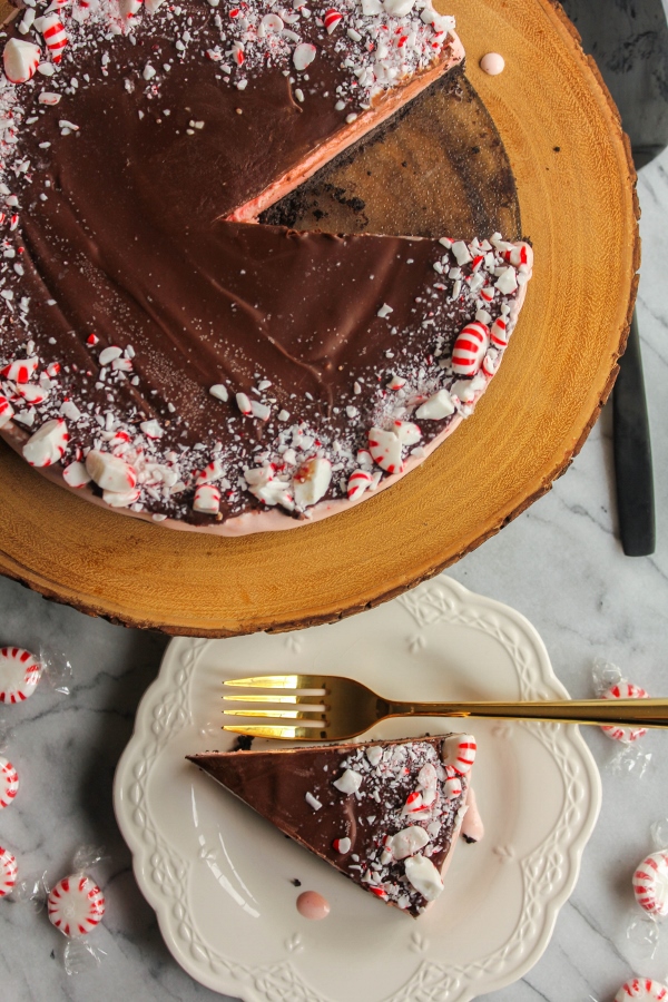 This Chocolate Peppermint Stick Ice Cream Cake is the perfect combination of a chocolate crust, creamy peppermint ice cream and crunchy peppermint pieces to make one delightful holiday dessert!