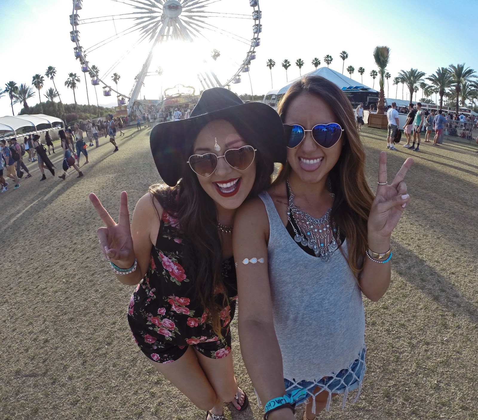Fashion bloggers Mash Elle and Boho Nouveau posing in a selfie with the iconic Coachella ferris wheel - Peace & Love: Coachella Outfits by popular Orlando fashion blogger Mash Elle