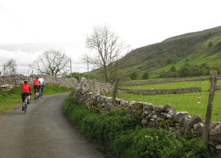 Our leader and two strong riders along a country lane, Yorkshire Dales, England