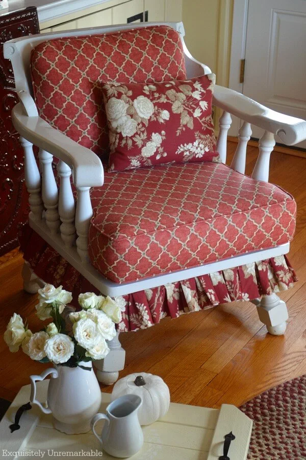 Cottage Style Fabric Chair with rose pillow on seat and fall tray with accessories on floor