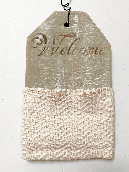 wall pocket with sweater pocket and Welcome sign