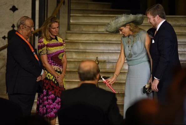 Queen Maxima wore Sandro blue ring detail midi dress. Queen Maxima wore a new turquoise green tulle dress by Natan