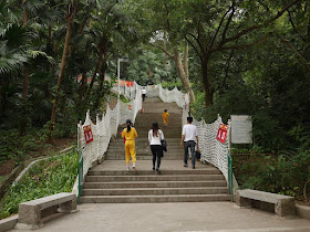 People walking up stairs lined with rope netting at Zhongshan Park in Zhongshan