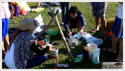 Ivane Gesite and Mark Joseph Gesite cooking breakfast