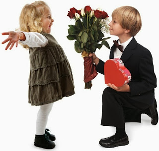 small boy purposing a girl by giving Roses