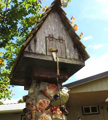 rustic bird house with shells