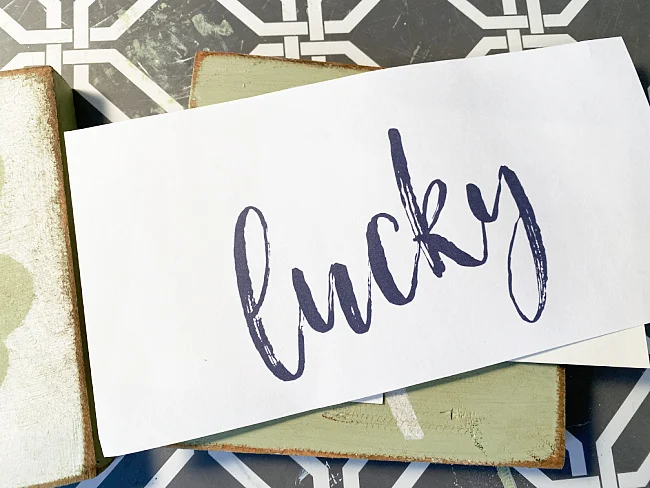 lucky print out on wooden board